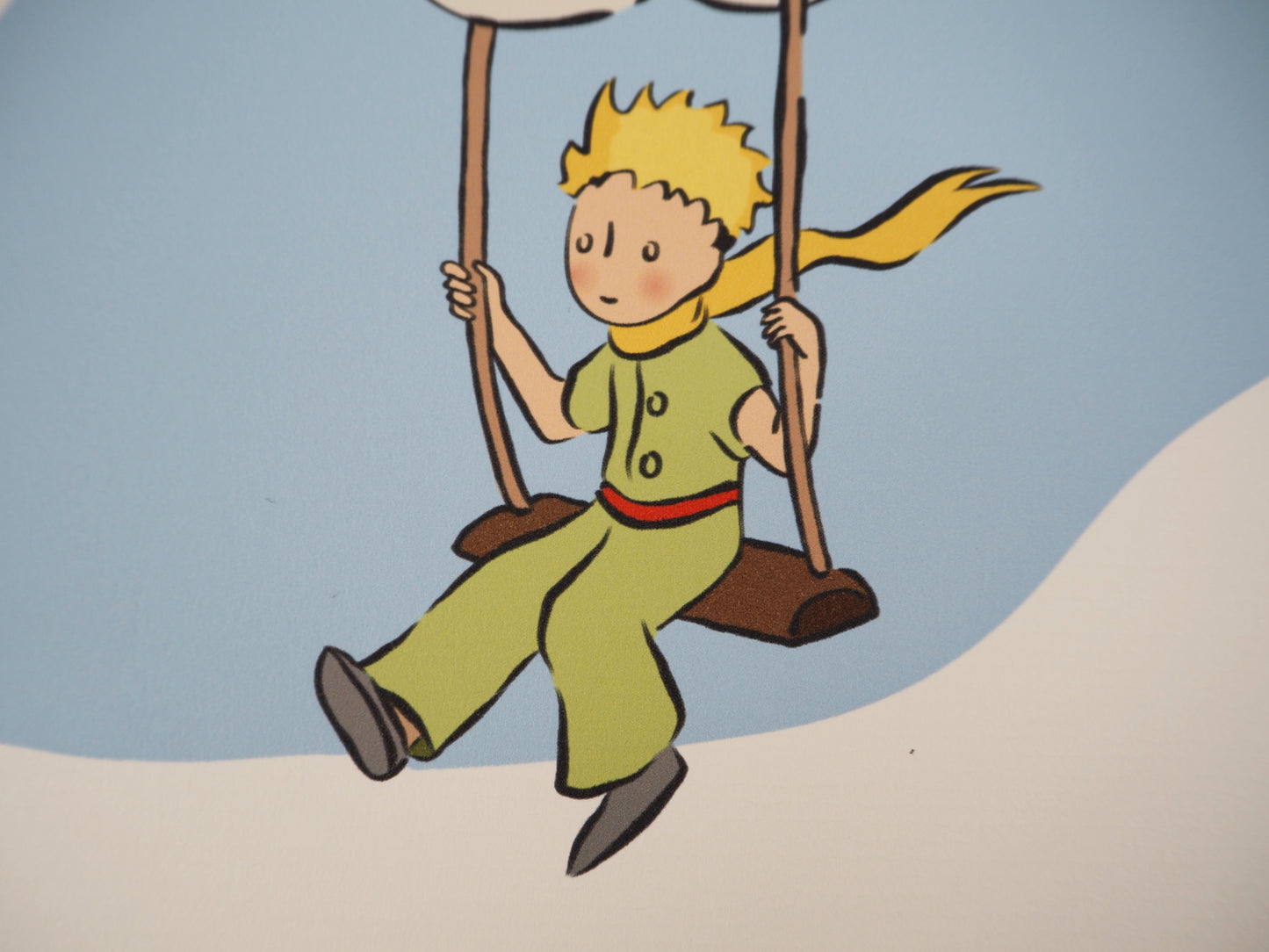 Antoine DE SAINT EXUPERY : Le Petit Prince sur une balançoire - Lithographie