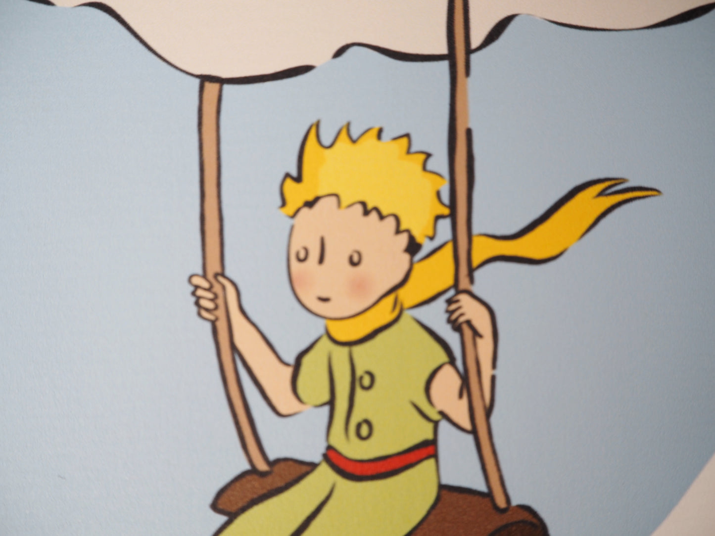 Antoine DE SAINT EXUPERY : Le Petit Prince sur une balançoire - Lithographie
